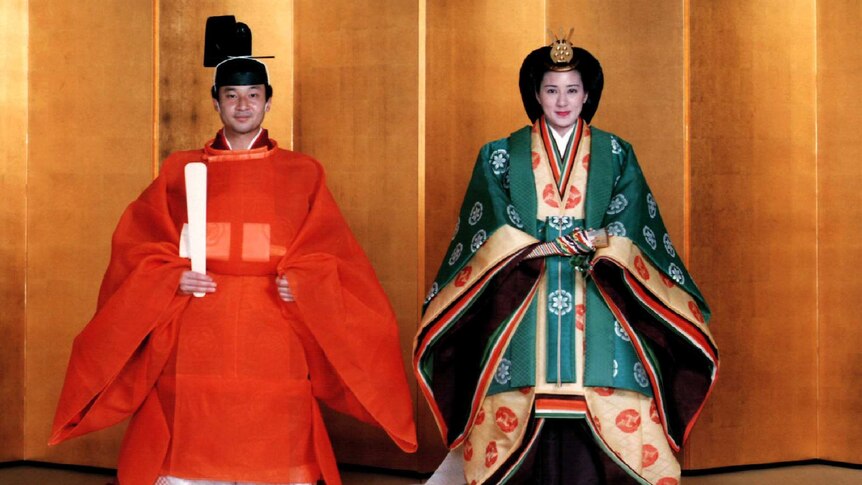 Crown Prince Naruhito and Masako pose for a photo in traditional Japanese dress