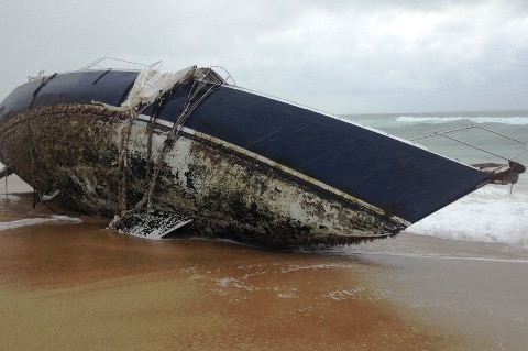 An abandoned yacht on the beach at Wooli.