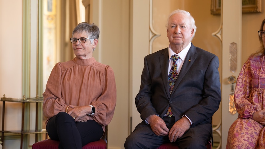 Gerry and Rick Rockliff sit next to each other in a room at Government House