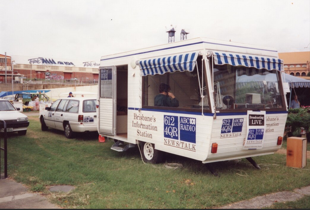 An old photo of a radio broadcasting caravan with 4QR on the side.