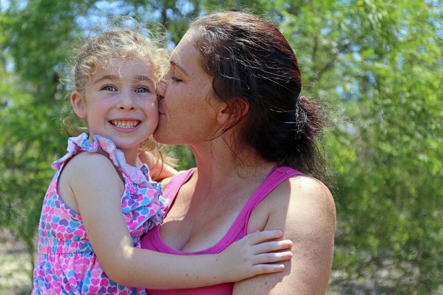 Samantha Fielden kisses her daughter Harmony