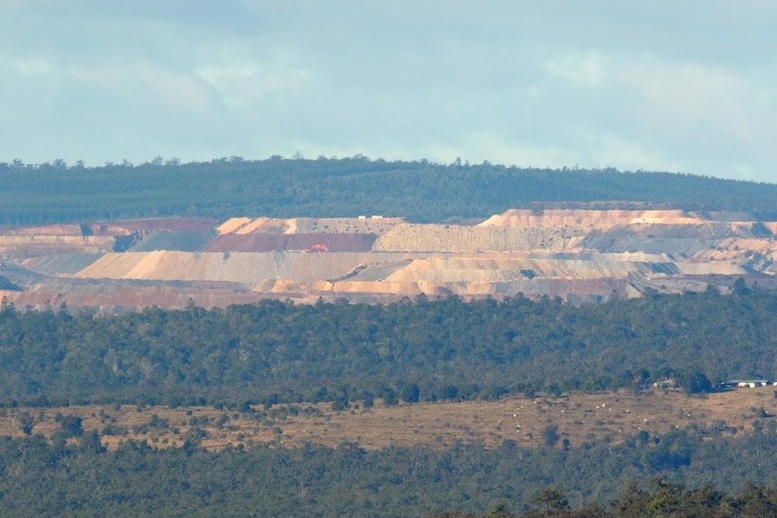 Wide shot of an open-cut coal mine.