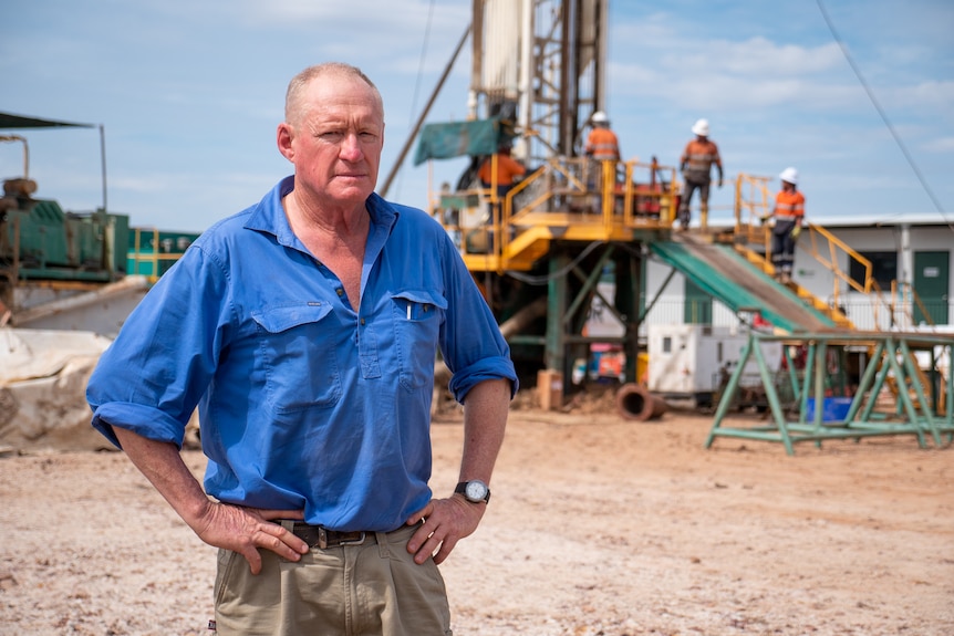 Farmer Ken Cameron standing in front of a drill risk on his property in Southern Queensland, February 2023.