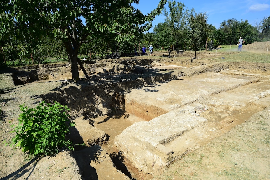 Local workers remove soil around the tomb of Ottoman Sultan Suleiman the Magnificent, near Szigetvar on September 2, 2016.