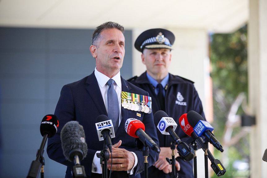 Paul Papalia addresses media with Col Blanch in the background
