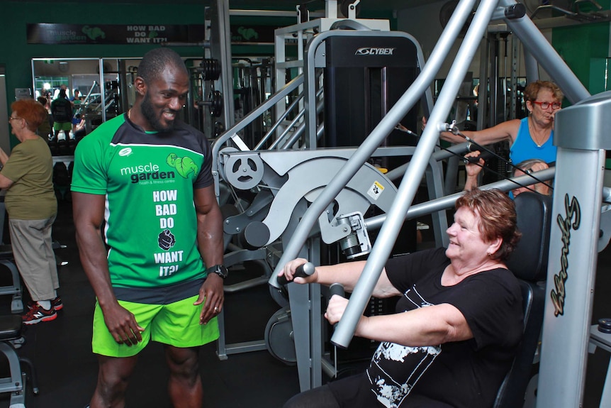 Kay watching Karol push weights smiling