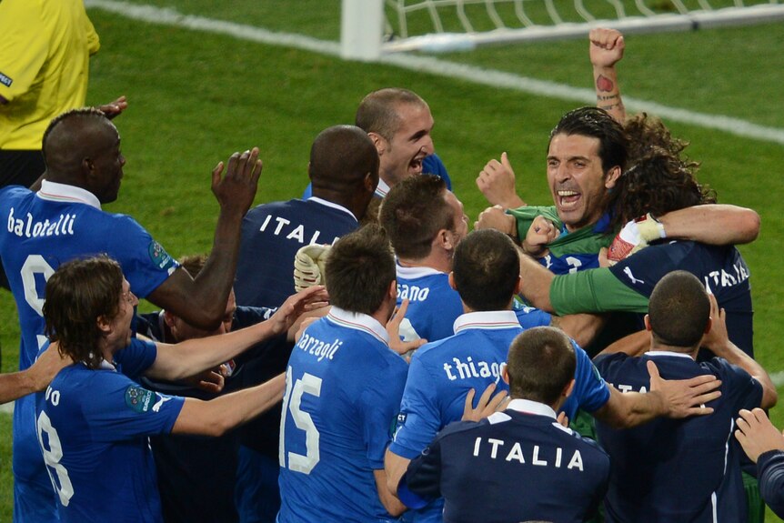Italian players celebrate with Buffon