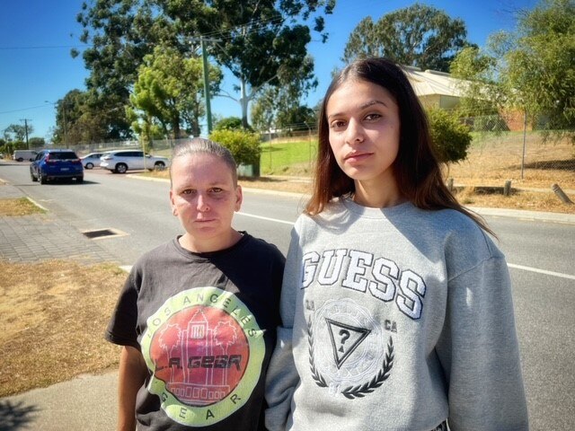 Takita and Lisa Rance in the suburban street where the stabbing occurred. 