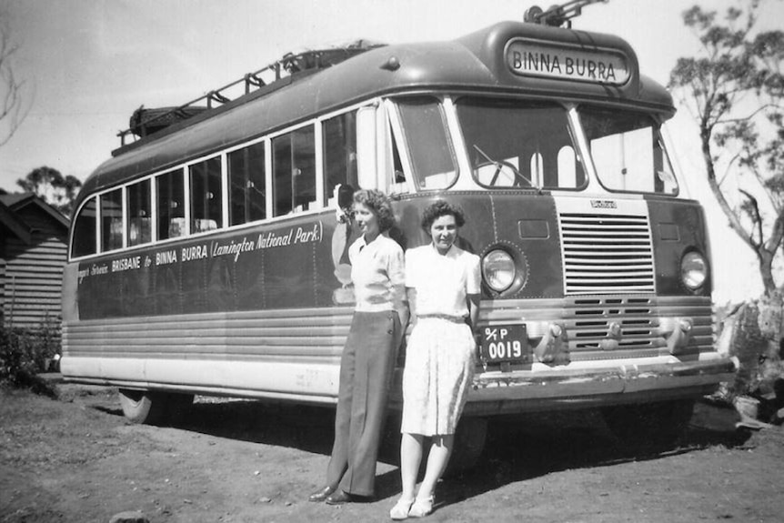 Binna Burra bus with two women standing in front, circa 1940s.