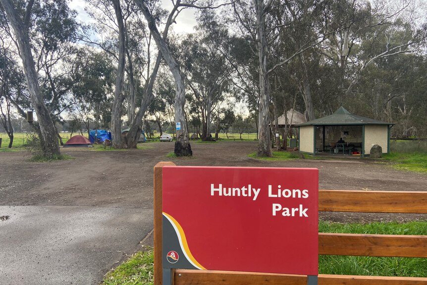 A photo of the huntly lions park including sign and tents