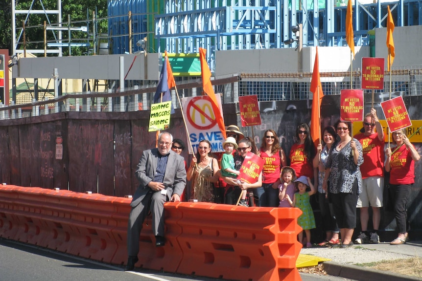 Protesters gather at the site of the Tecoma restaurant