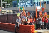Protesters gather at the site of the Tecoma restaurant