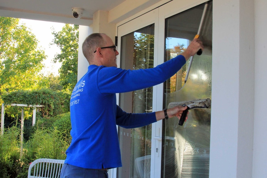 A man washing a window