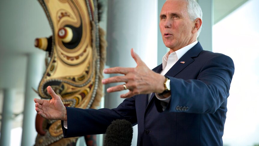 US Vice President Mike Pence speaking with reports at the APEC summit.