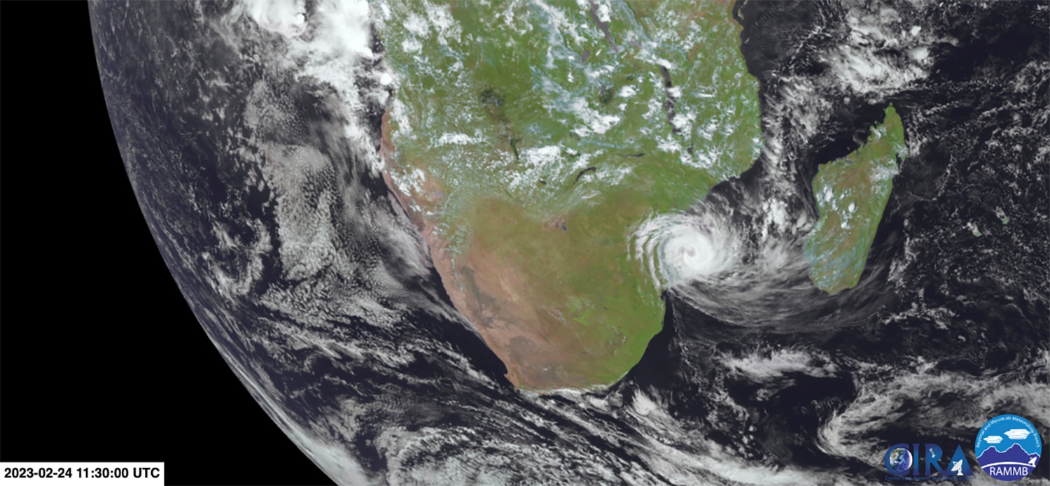 A satellite image shows a cyclone coming ashore over Mozambique.