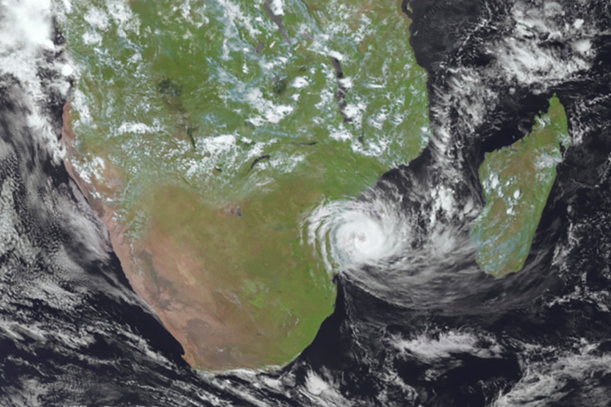 A satellite image shows a cyclone coming ashore over Mozambique.