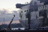 Emergency officials begin inspection of fire-destroyed Italian car ferry