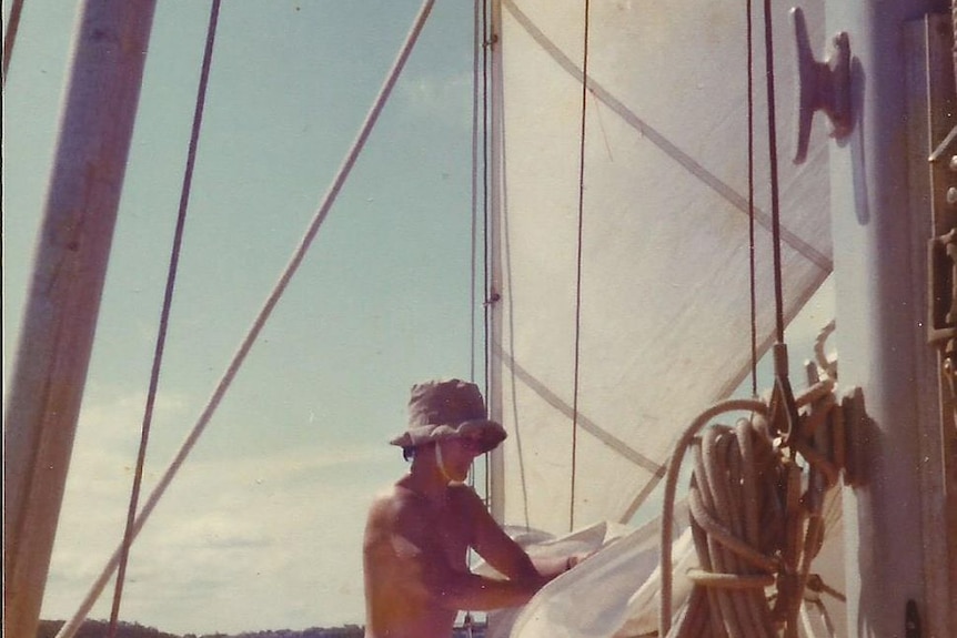 Naked woman on a sail boat