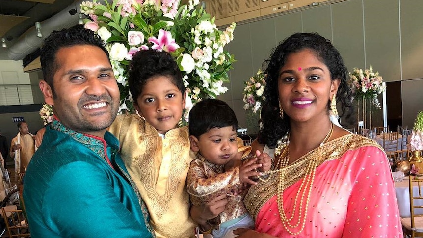 Thushani Srignanaguru and husband Ramesh with their children