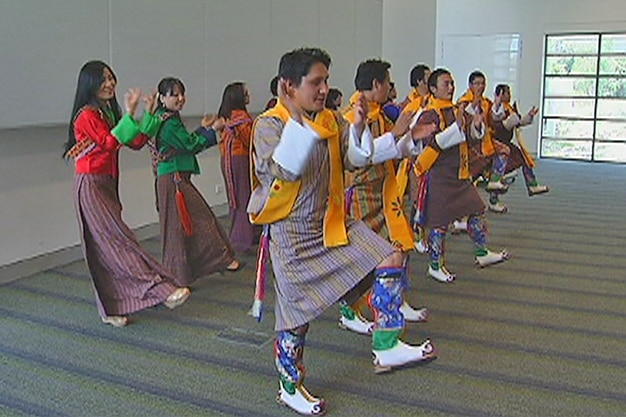 Bhutanese students dance during the royal visit at the University of Canberra.