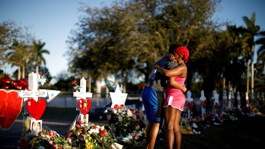 Stoneman Douglas high school studen Adin Chistian embraces his mother Denyse.