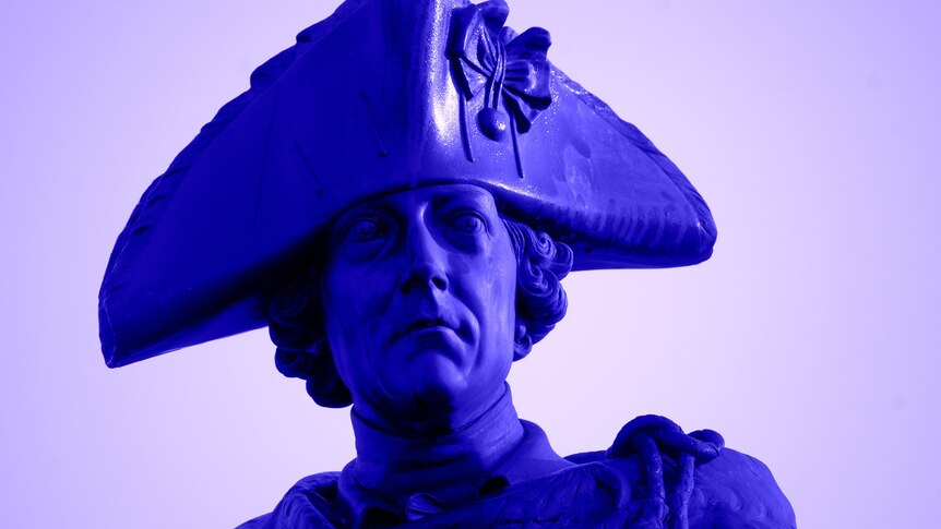 A close-up image of a bronze statue of Frederick the Great's head, wearing a hat. 