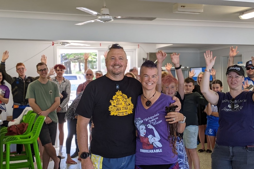 Fiona and husband Craige surrounded by cheering supports and fundraiser