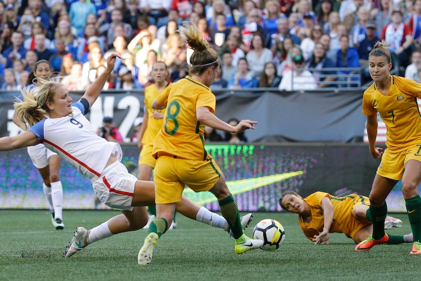 U.S. forward Lindsey Horan (L), reaches for the ball against the Matildas in Seattle.