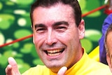 Yellow Wiggle, Greg Page, performs with the other Wiggles.