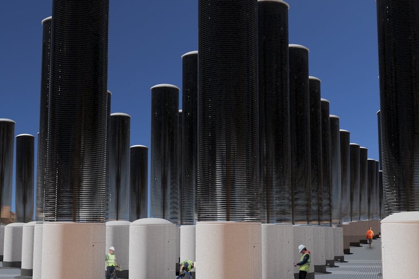 A computer rendering of many tall steel columns 