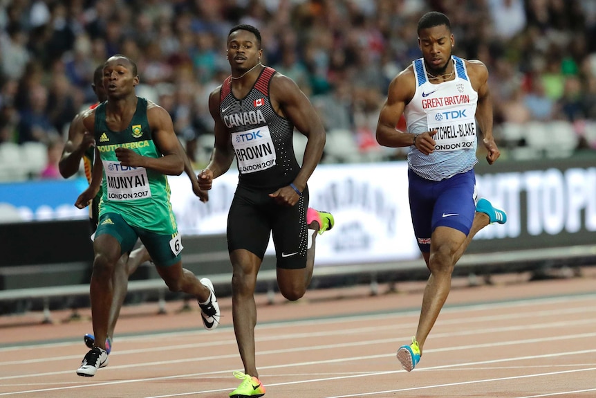 Aaron Brown running mid stride at the world athletics championships.
