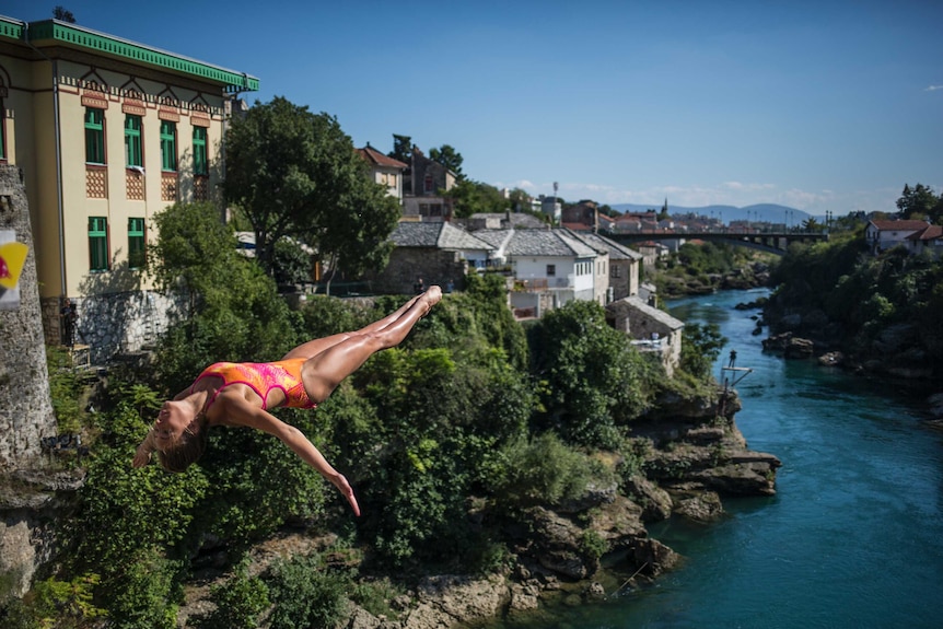 Helena Merten of Australia dives from the 21.5 metre platform on Stari Most bridge.
