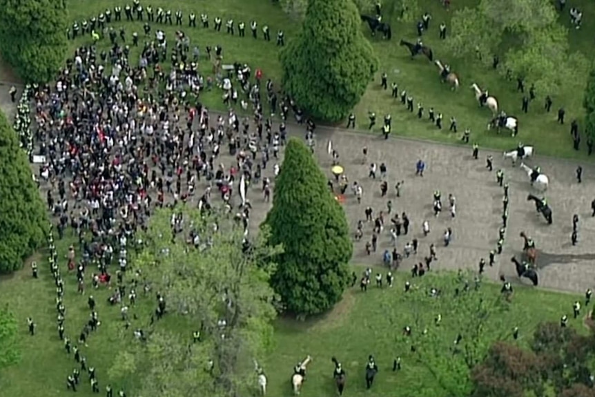 An aerial image shows police surrounding demonstrators at an anti-lockdown protest at the Shrine of Remembrance in Melbourne.