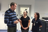 Health Minister Michael Ferguson with two hospital staff.