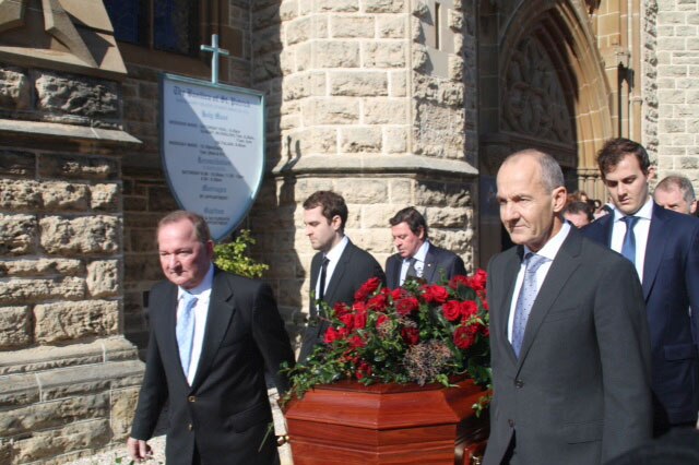 Alan Bond's coffin leaves the church in Fremantle.