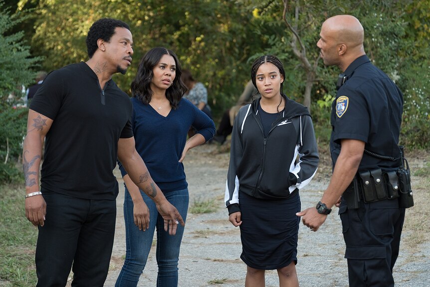 Colour still of Russell Horsnby, Regina Hall, Amandla Stenberg and Common in 2018 film The Hate U Give.