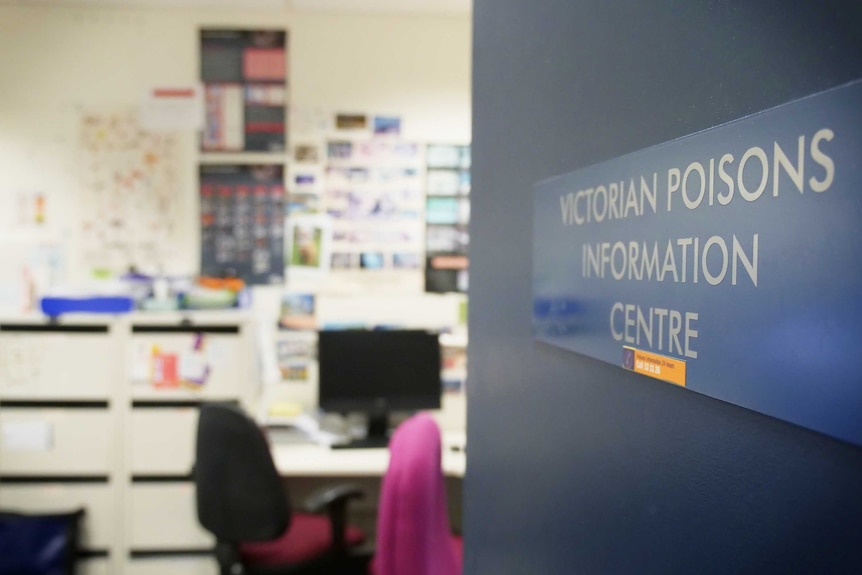 A door is left ajar, showing the inside of the poisons centre office