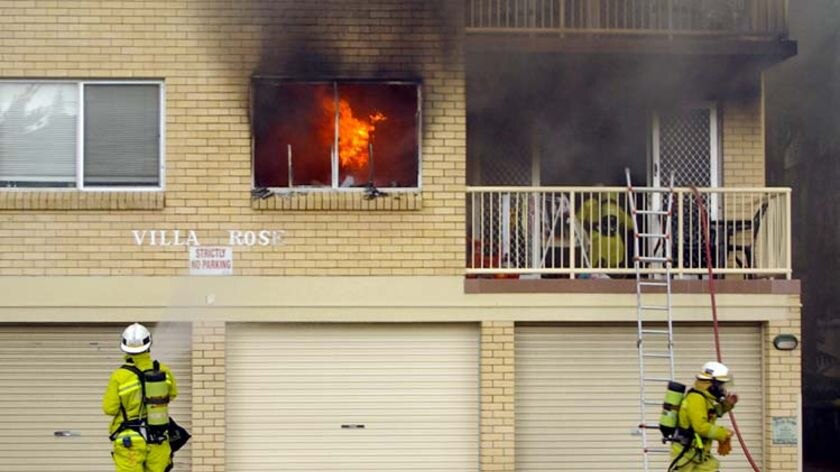 Firefighters tackle a blaze at a unit