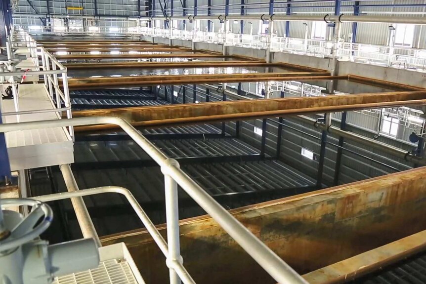Tanks filled with water at a desalination plant.