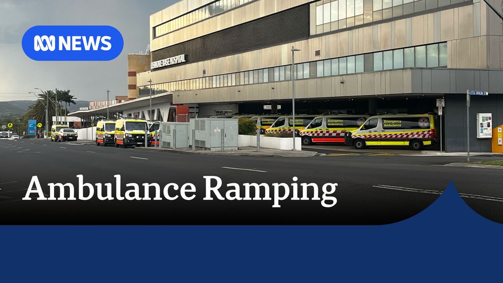 Ambulance Ramping. An exterior of a regional hospital with ambulances lined up and parked in spaces around the building. 