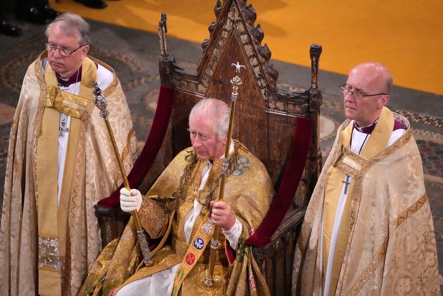 King Charles held the Sovereign’s Sceptre with Cross in his right hand and the Sovereign Spector with Dove in his left