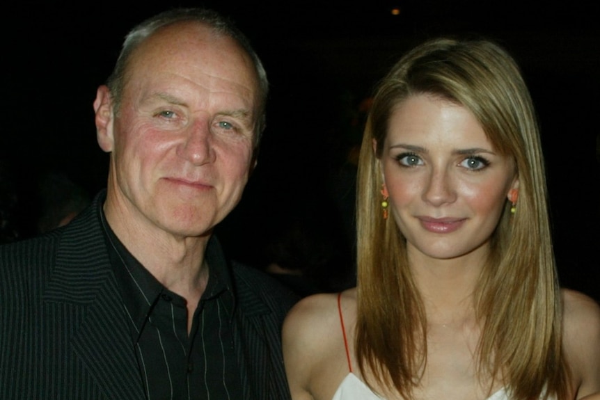 Alan Dale and Actress Mischa Barton smile for the camera