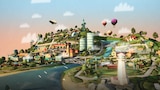Community with houses, businesses, hills, river, parks, blimp and hot air balloons
