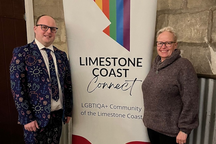 A man and woman standing in front of a sign that reads Limestone Coast Connect. 