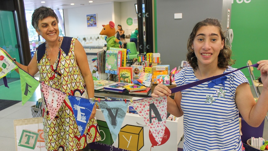 Donna Toussaint alongside her daughter Freya at their social enterprise shop.