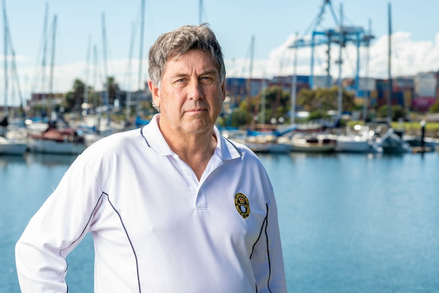 David Eldridge stands in front of the Outer Harbor marina.