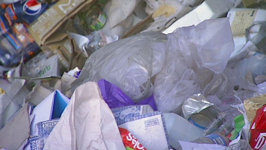 Video still: Close up of rubbish pile including numerous plastic shopping bags in Canberra, ACT. Good generic
