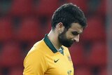 Mile Jedinak reacts to Australia's loss to Belgium