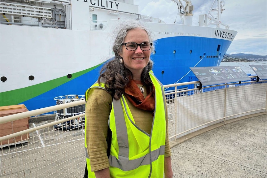 Marine biologist Caroline Sutton stands in front of the RV Investigator in Hobart.