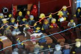 Lego Australian Senate chamber with chart of MPs' pay superimposed